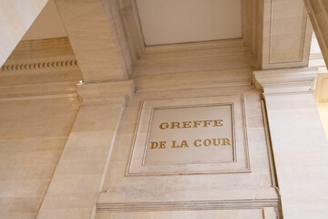 greffe de la cour text on ancient wall facade building means in french justice court clerk of the...
