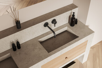 Top view of light bathroom interior with sink and accessories