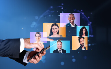 Businessman holding tablet device with online video chat with co