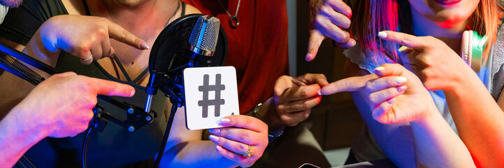 Hashtag concept – hash tag symbol – group happy friends show hashtag symbol – young people...