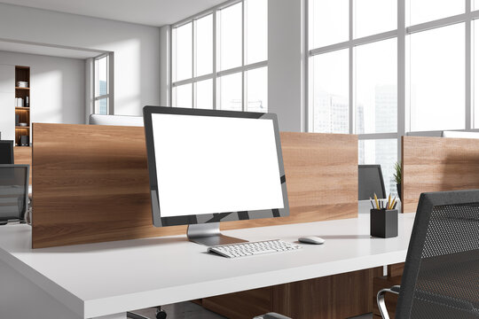 Business interior with pc desktop on table with mockup display, panoramic window