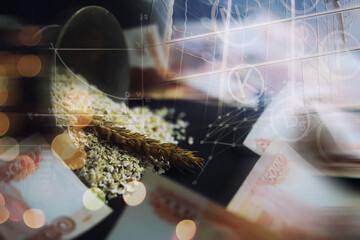 The concept of the cost of grain. 5000 ruble banknotes around a handful of ground grain. World...