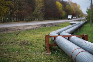 Metal pipes on the street. pipes from the pipeline. gas pipeline for gas pumping. heat-pipe. large...