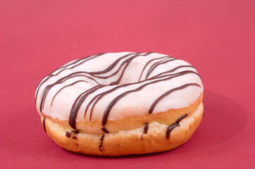 Glazed sweet doughnut on red background - 559361044