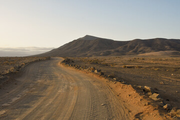 Fototapeta na wymiar Road in a volcanic landscape of Lanzarote