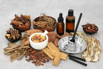 Moxibustion treatment with charcoal moxa sticks, Chinese herbs and spice. Herbal plant based medicine concept for natural healing remedy.