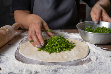 chef making dough with flour and herbs