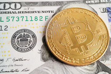 Golden bitcoin on US dollar banknotes money for business and commercial, Digital currency, Virtual cryptocurrency, blockchain technology.