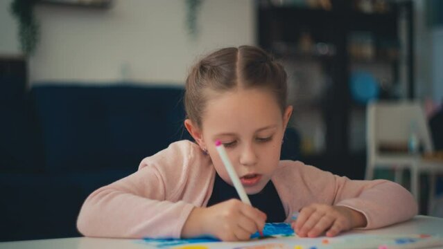 Little girl drawing picture alone, creativity development, preschool education