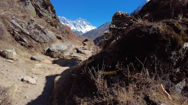 Dingboche, Nepal: Point of view footage of an hiker walking the trail toward Everest base camp between Pangboche and Dingboche along the Imjla Khola river