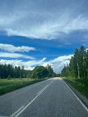 Empty road at the green landscape