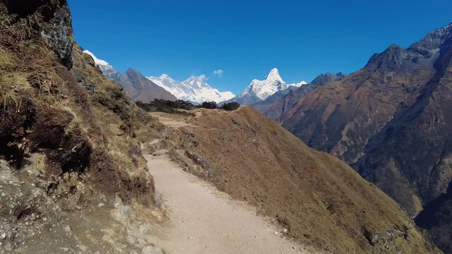 Namche Bazaar, Nepal: Point of view footage of an hiker walking the trail toward Everest base camp between Pangboche and Namche Bazaar with view of Mt Everest and Ama Dablam peaks in the Himalayas