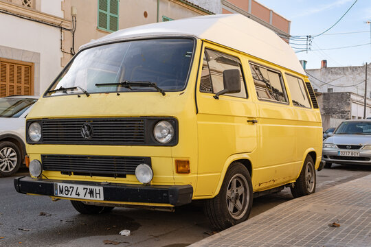 Yellow Volkswagen T3 van parked