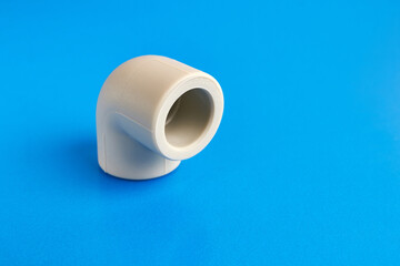 The connection angle of the thermoplastic pipe at an angle of 90 degrees. Concept of installation of water supply and sewage systems.