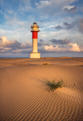 Lighthouse at El Fangar Beach at sunset,  Deltebre, Catalonia