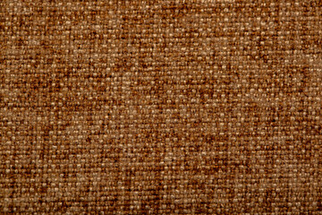Close-up fabric swatches as a background. The texture of the material with patterns of weaving close-up. Upholstery fabric for interior decoration.