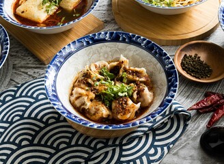 Chongqing Spicy Dumplings served in dish isolated on napkin top view on table taiwan food