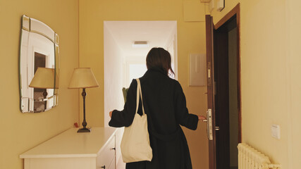 Young woman returning home