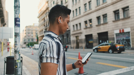 Close-up of man's hands using mobile phone