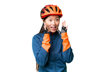 Young cyclist woman over isolated chroma key background with surprise facial expression