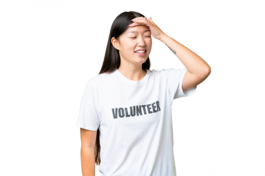 Young volunteer woman over isolated chroma key background smiling a lot