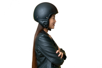 Young Asian woman with a motorcycle helmet over isolated chroma key background in lateral position