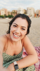 Happy young woman making funny faces and taking selfie