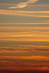 Blue orange sunset on horizon in portrait format 