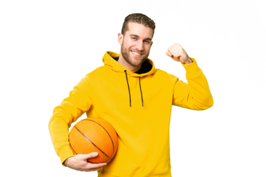 Young handsome blonde man over isolated chroma key background playing basketball and proud of himself