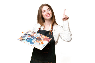 Young artist woman holding a palette over isolated chroma key background pointing up a great idea