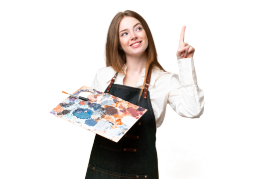 Young artist woman holding a palette over isolated chroma key background pointing up a great idea