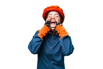 Young cyclist woman over isolated chroma key background shouting and announcing something