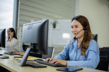 Asian telemarketing agent in call center office