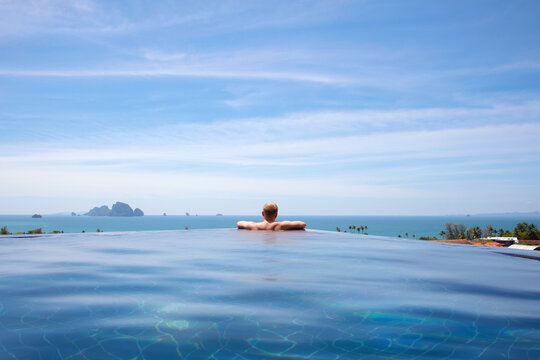 Male Resting In Infinity Pool At Aonang Cliff Beach Resort