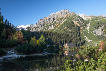 Fototapeta na wymiar Poprad Lake with autumn forests from the hiking trail in High Tatras National Park, Slovakia