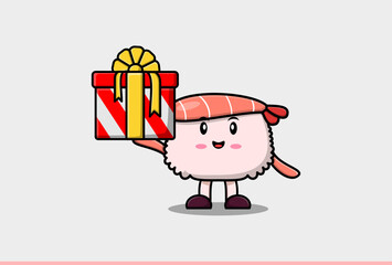 Cute cartoon Sushi shrimp character holding gift box in vector icon illustration