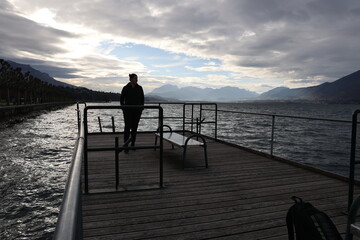 Fototapeta premium silhouette of a person on the pier