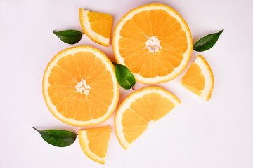 Fresh orange citrus fruit with leaves on white background
