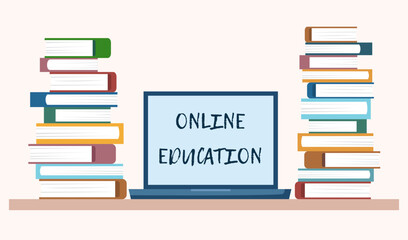 Online education concept - laptop and stacks of books