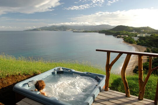 Woman in a jacuzzi on the Caribbean island of Grenada.