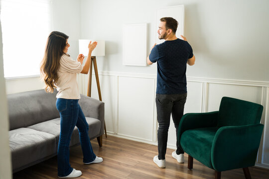 Happy Couple Decorating Their New Home