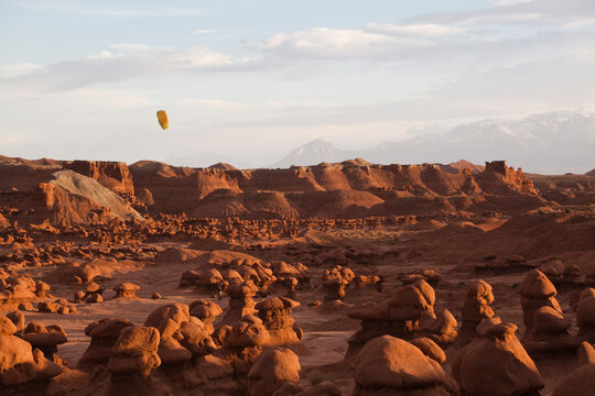 A kite flies over the vast field of hoodoos at Goblin Valley State Park, Utah.