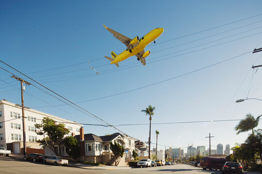With the San Diego skyline in the background, an airplane approaches the San Diego airport on Dec. 12, 2015.