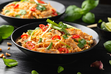 Chicken Pad Thai with eggs, bean sprouts, peanuts and spring onion © grinchh
