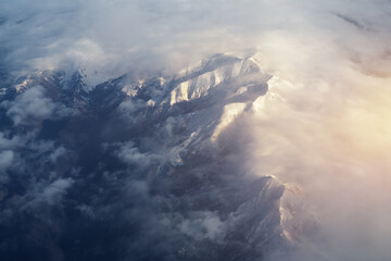 Mountain range and white clouds in blue sky at day