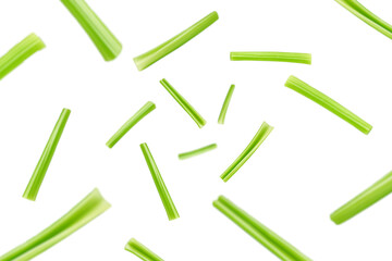 Falling celery isolated on white background, selective focus