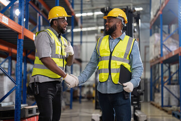 African american working in warehouse check forklift truck loading carton box smile check hand