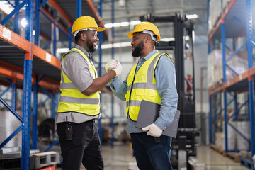 African american working in warehouse check forklift truck loading carton box smile check hand