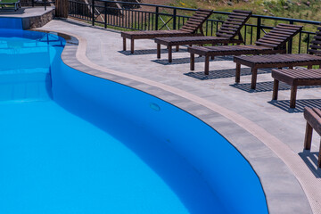 swimming pool on the background of blue water