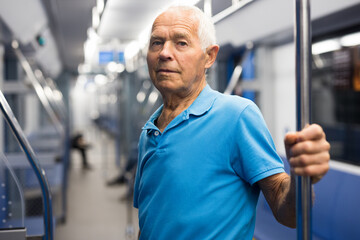 Elderly man in subway train